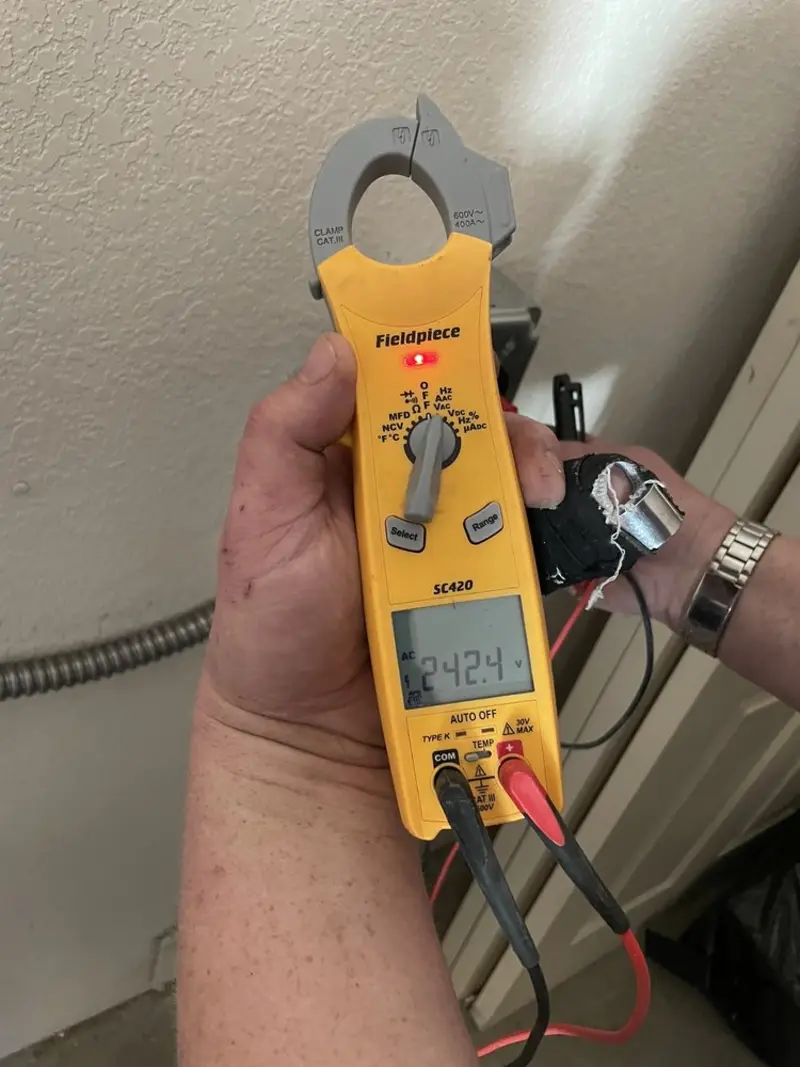Voltage testing with clamp meter during Outlet Installation in Wintersville